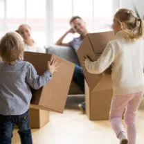 Kids running to their parents with boxes in their hands